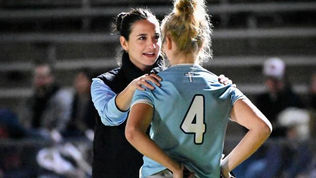 Sam Geiersbach speaks to one of her Valor Christian players